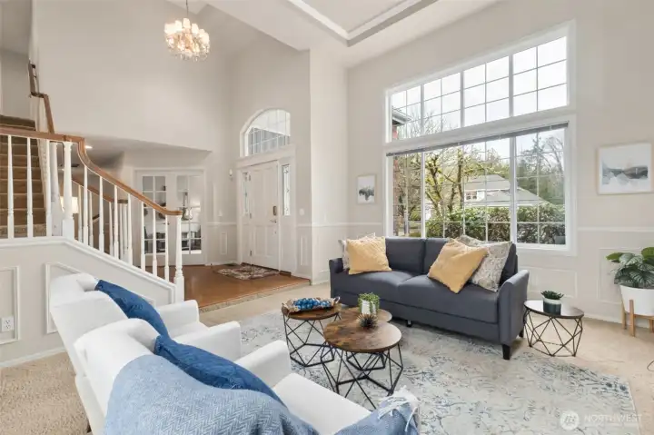 Off the entry is the spacious living room - or as many call it "The Christmas Tree Room", think of how tall your tree can be here? Two story entry and coved ceiling in the living room.