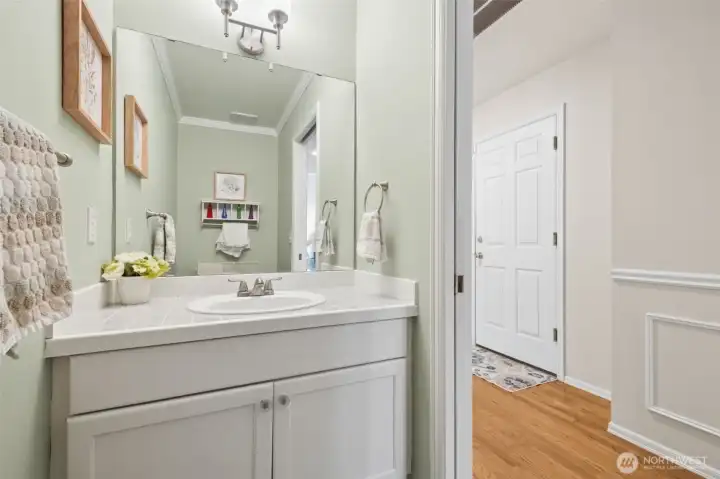 Convenient powder room located downstairs.