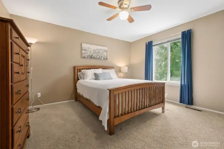 Bedroom #2, very large with ceiling fan and a substantial closet at the bottom right of this photo.