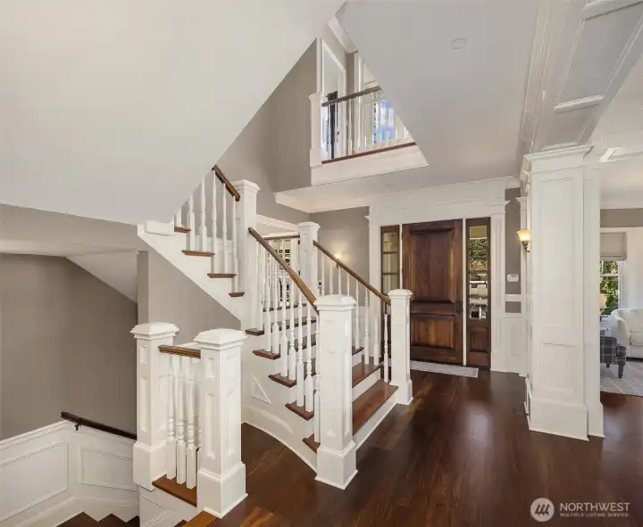 Soaring light filled foyer entrance is so open and inviting.  Hardwood floors have all been refinished.