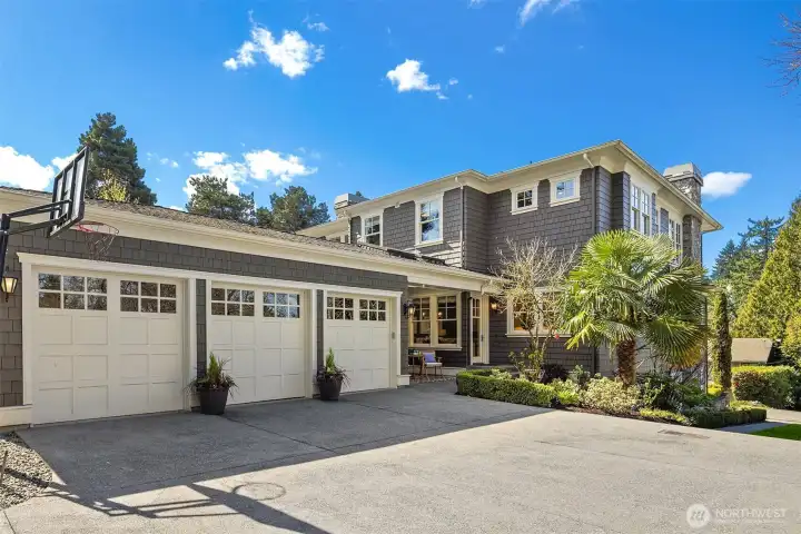 3 car garage tucked away behind the house.