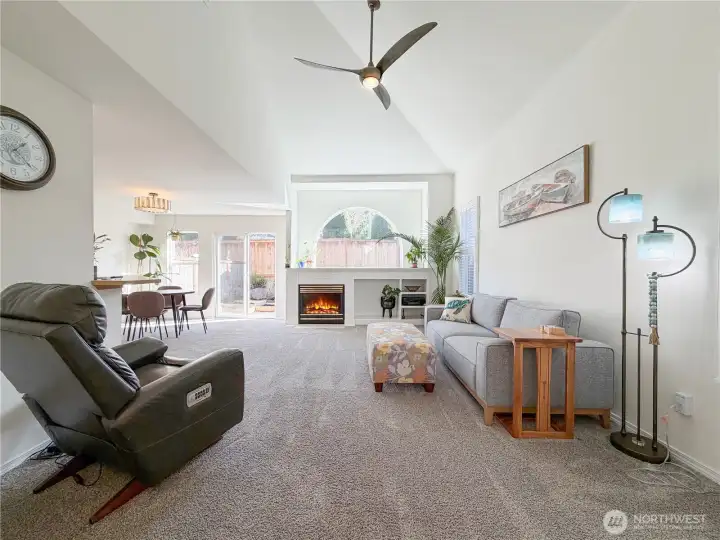 Large sunny living room with vaulted ceilings.