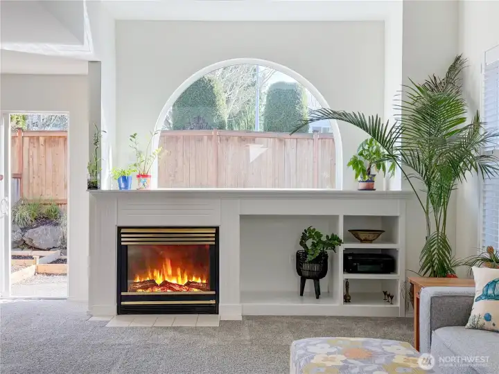 Cozy gas fireplace and lovely built-ins