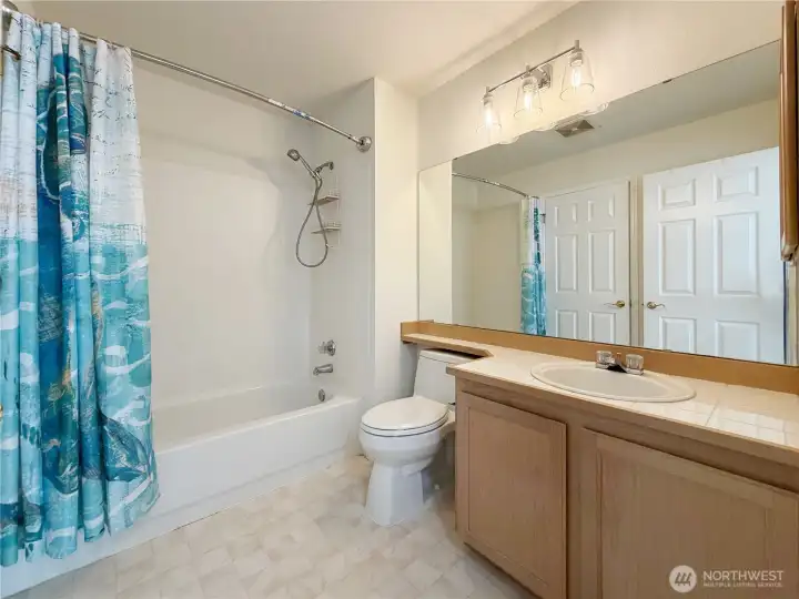 En suite to upstairs Primary Bedroom accessible with 2 entrances