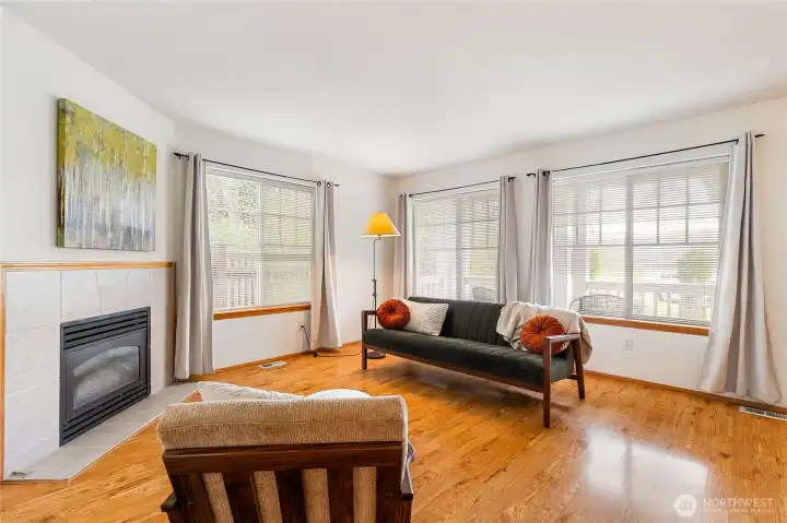 Expansive windows fill the living space with abundant natural light, creating a bright and inviting atmosphere.