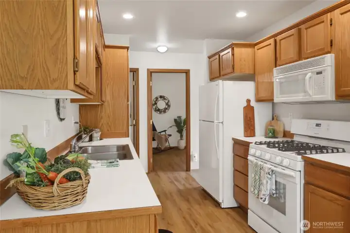 Smart kitchen layout keeps everything within easy reach while connecting naturally to the home’s living spaces.
