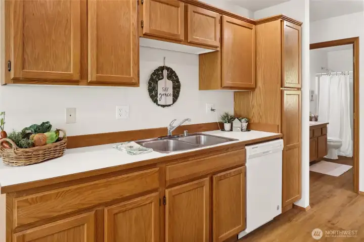 White appliances and pantry space.