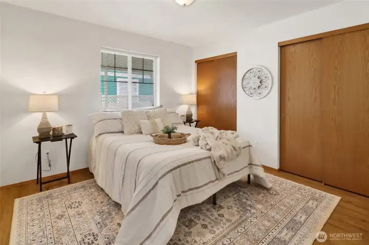 Simple comfort meets quiet privacy in the primary bedroom.