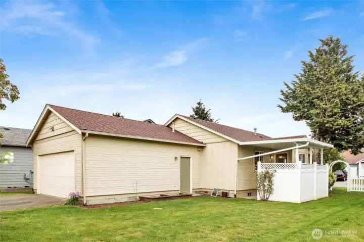 A nice sized yard with some small raised beds for your green thumb.