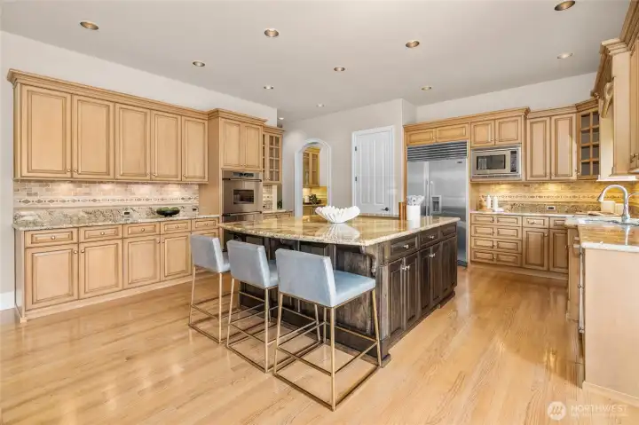 Kitchen is one of the largest at The Reserve with double Dacor ovens, Subzero fridge, quartz, travertine tile, walk-in pantry and water filtration system.