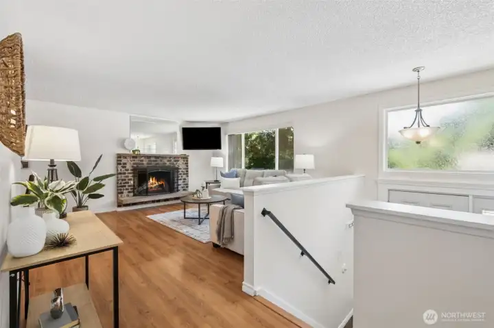 Wood laminate floors, plenty of natural light and fresh interior paint make for a cheerful & welcoming gathering space.