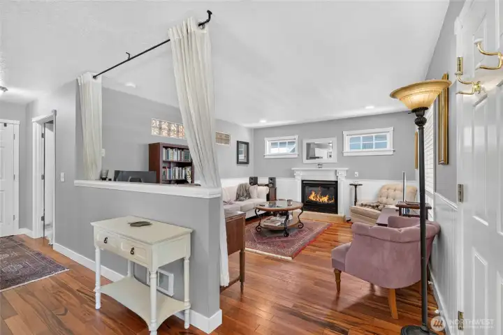 The gorgeous new hardwood floors bring you into the elegant interior. Enjoy your lovely living room with the propane fireplace adding to the warmth and comfort of this classic beachside cottage. The gorgeous new hardwood floors bring you into the elegant interior. Enjoy your lovely living room with the propane fireplace adding to the warmth and comfort of this classic beachside cottage.