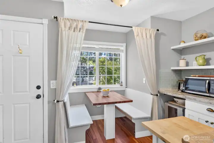 With open shelving and a hardwood tabletop, the corner nook adds charm and convenience to the kitchen. With open shelving and a hardwood tabletop, the corner nook adds charm and convenience to the kitchen.