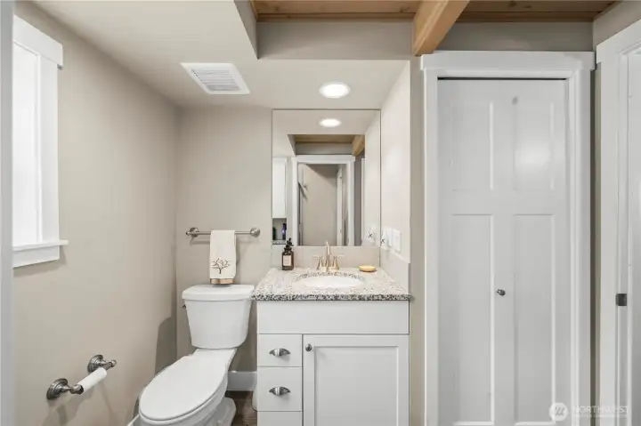 The main floor bath with two entrances, one from the hall and one from the primary bedroom