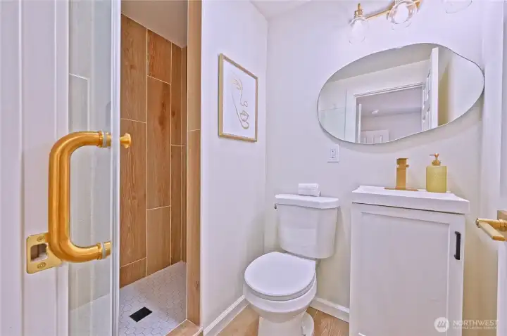 Primary bedroom includes a new private bathroom with a modern walk-in shower.