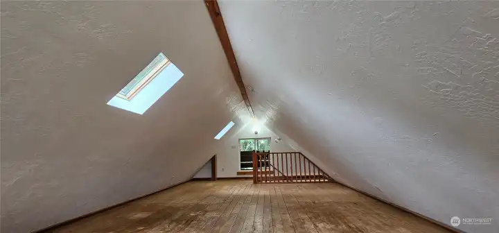 3rd level is a full length bonus room with windows and mini balcony on both ends, and 2 skylights.