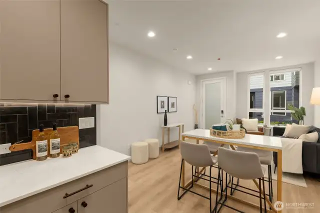 Enjoy the open flow from the kitchen to the dining and living areas. This layout is perfect for those who love entertaining or appreciate a spacious home environment.