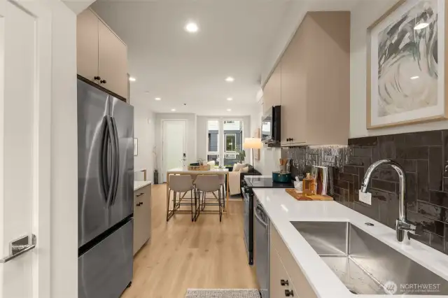 The sleek cabinetry and quality finishes create a stylish yet highly functional cooking space.