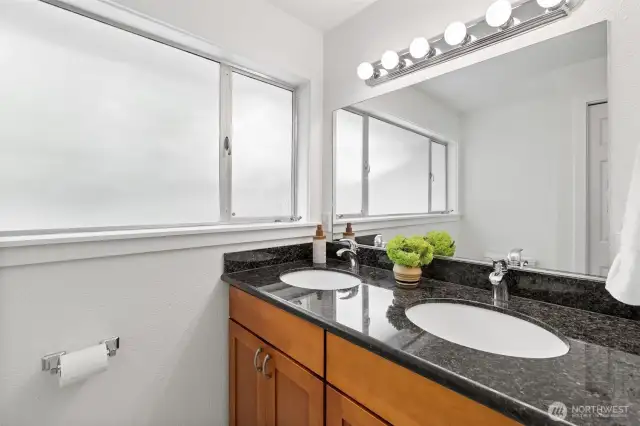 Shared bath features a large double vanity