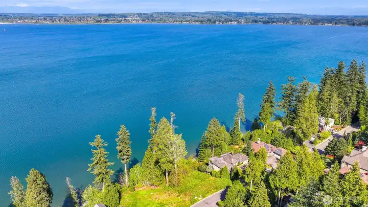 Ariel views capturing the property's elevated setting above the shoreline.