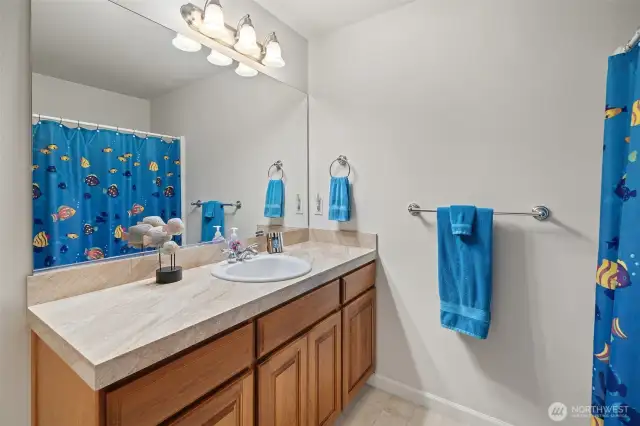 The main floor guest bath has a shower/tub combo.