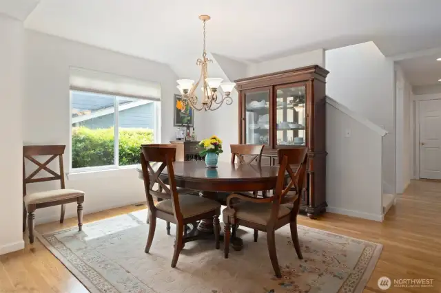 The dining room opens to the kitchen and living areas. The staircase leads to the 2nd floor bonus room & guest room/den.
