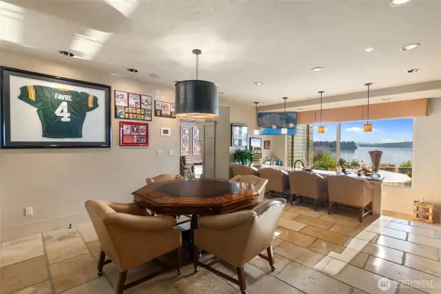 Gamers will love the custom delux gaming table with adjoining bar area. Offering spectacular water views as do most of the major rooms in the home.