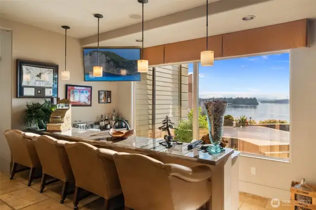 Sunken wet bar, twin dishwashers, full bar appointments and the never ending water views