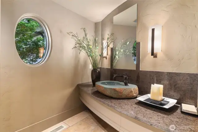 Many unique features such as this formed rock sink in one of the 1/2 baths