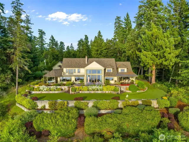 Mature landscaping. Much of the lawn is 0 maintenance astro turf. Low voltage evening lights in flower gardens.  Astro turfed Bocce ball court on the lower terrace.