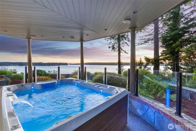 Relax in the all weather, wind protected hot tub area accessed from the Primary bedroom