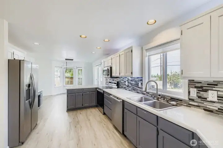 Generous counter space, pantry storage, and a sink upgrade you didn’t know you needed -  built-in bottle rinser for modern convenience.  This kitchen is built for everyday ease