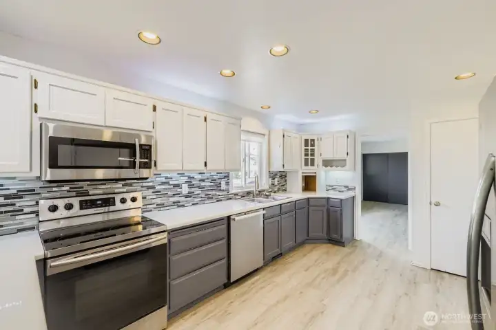 Appliance garage with built-in outlets, ideal for your KitchenAid mixer or Instant Pot. Kitchen flows seamlessly into the family room for easy entertaining