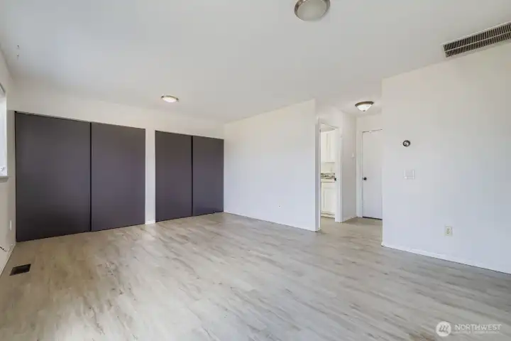 Family room features a full wall of closets, perfect for games, puzzles, and more