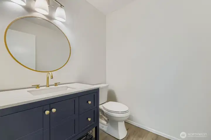 Guest half bath remodeled with contemporary touches