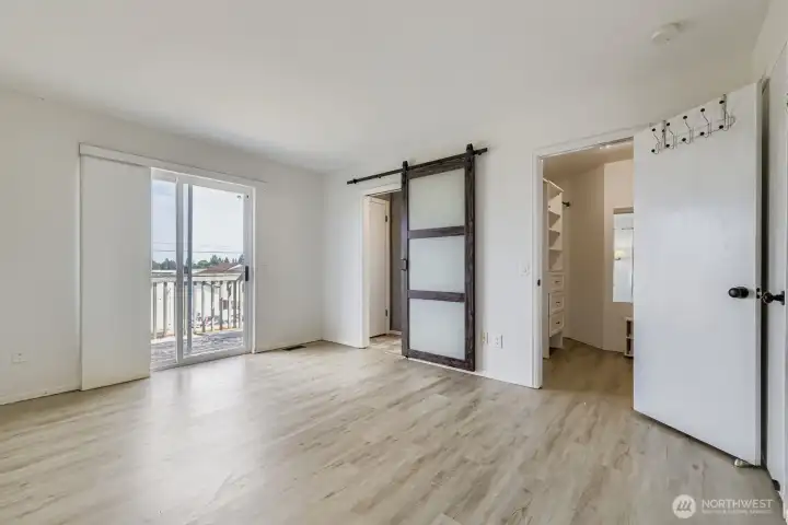 Spacious primary suite with sliders to a private deck, wake up to sweeping views of the Cascade Mountain Range