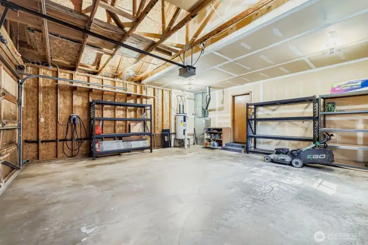 Impressive garage with storage galore and convenient EV charger. Overhead storage space - room to dream up a loft, studio, or gear zone