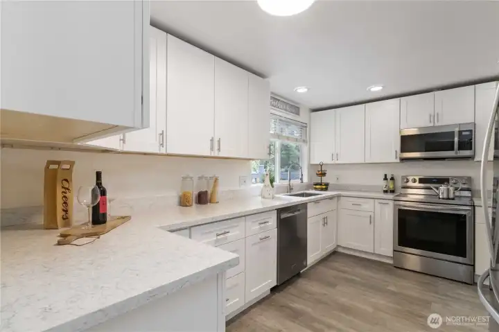 Beautifully updated kitchen featuring all stainless steel appliances.
