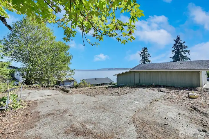 This pad used to be the old garage, but you will build something far superior, maybe a ADU like the neighbors.