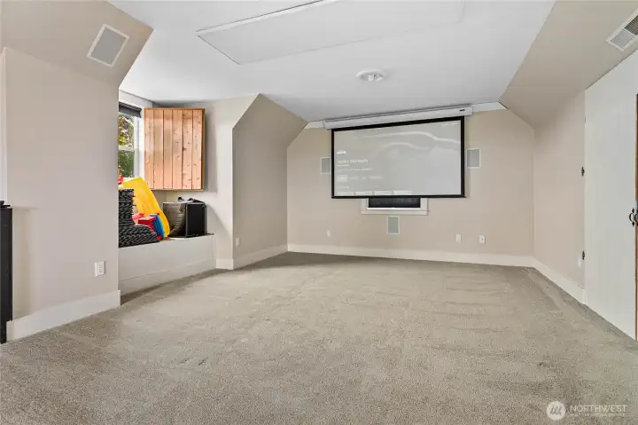 Projector, speakers, and retractable screen stay with the house!