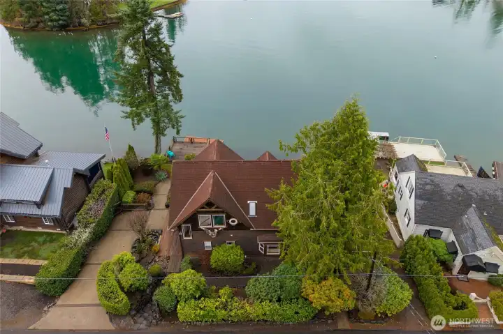 There is a driveway next to the house with tons of extra parking space across the street.