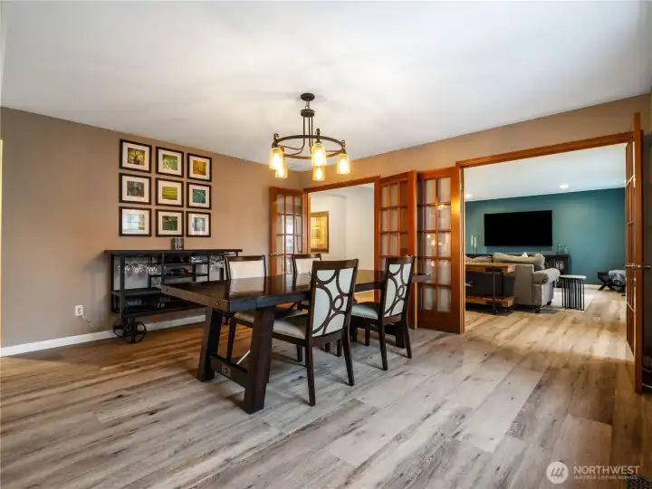 Formal dining and living areas can be closed off, offering flexibility and separation from the kitchen and additional living space