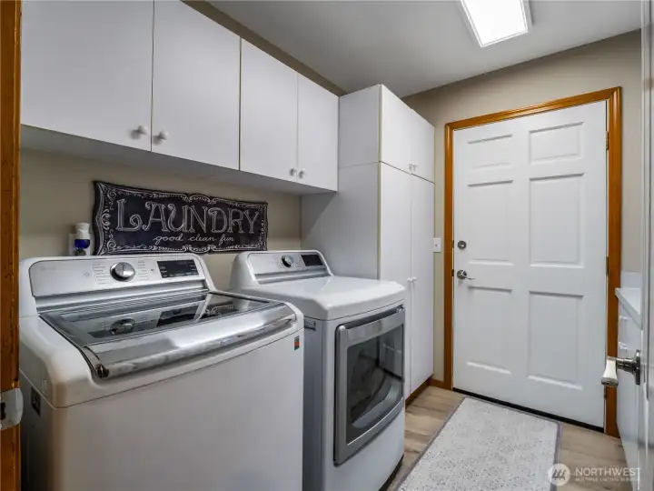 Main-level laundry room with direct access to the back of the home—perfect for bringing groceries straight inside with ease
