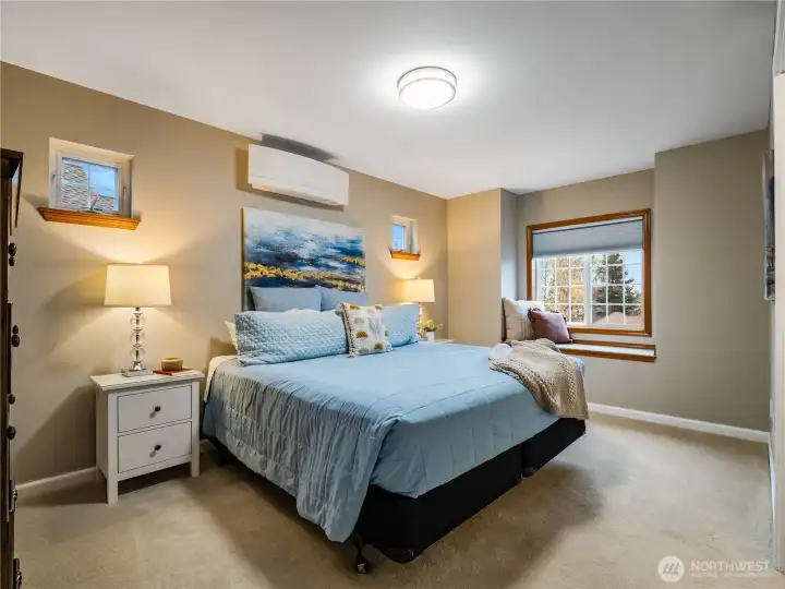 Second upstairs bedroom that mirrors the adjacent bedroom in size and layout