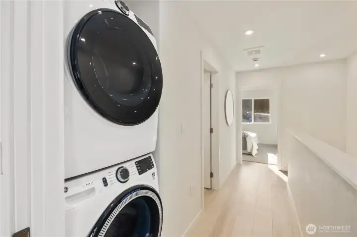 In-unit washer and dryer conveniently located on the upper floor.