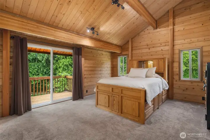 Bedroom 4, upstairs with direct access to private deck via sliding glass doors.