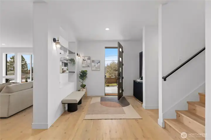 Large foyer area to greet your guests. With wide-plank oak wood floors
