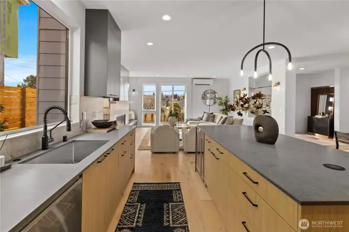 Chef kitchen flows seamlessly into the main living area