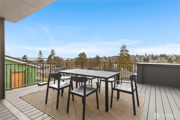 Large outdoor patio area on the 3rd level with water, city, mountain and territorial views.
