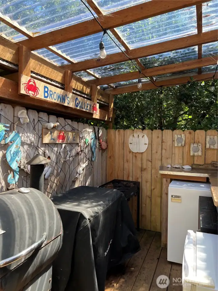 More storage space for cooking grill and smoker. Does not come with property.